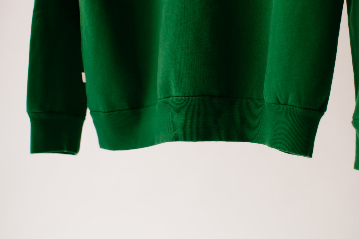 Green crewneck logo