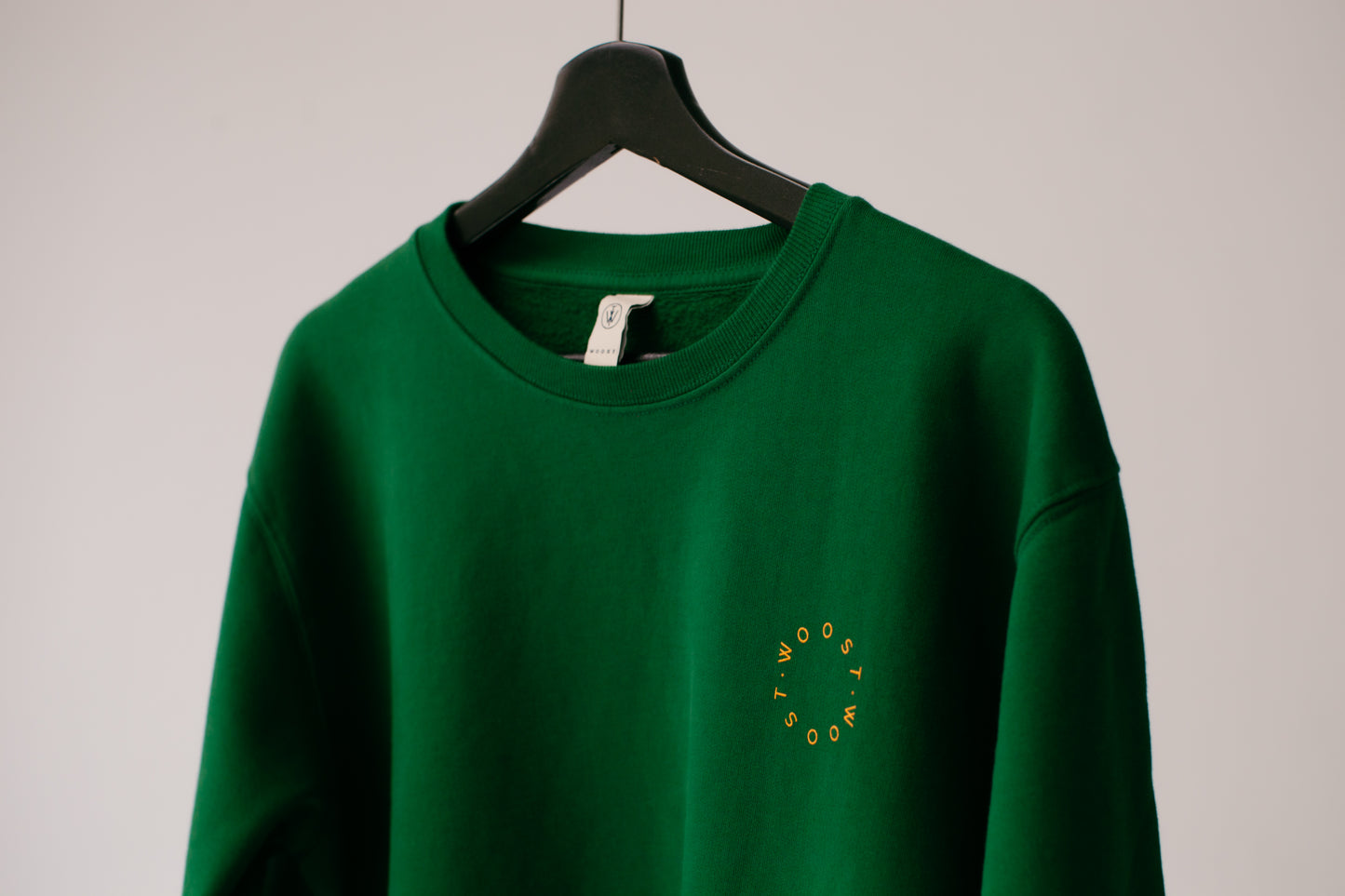 Green crewneck logo